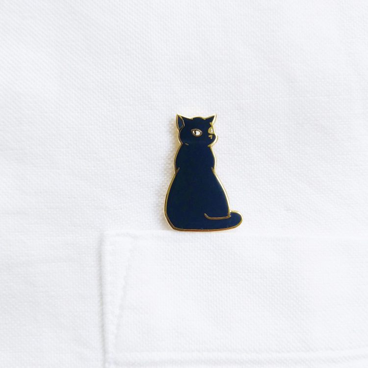 Bounty the Cat enamel pin on shirt