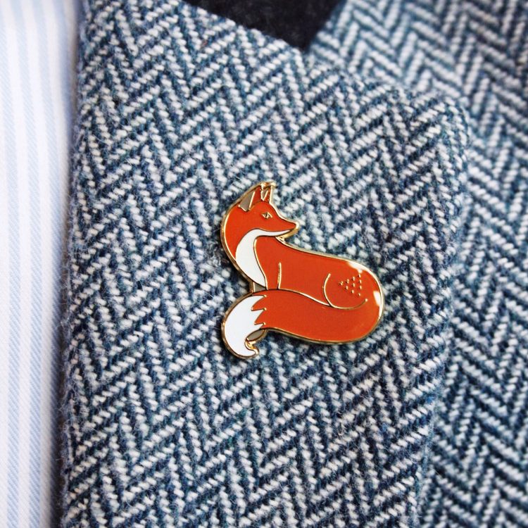 Quinn the Fox badge pin on blazer
